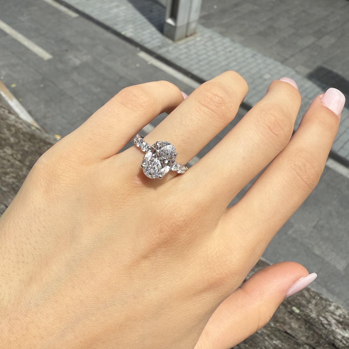 Sophia – Oval Solitaire with 0.1 ct Round Side Stones and hidden halo