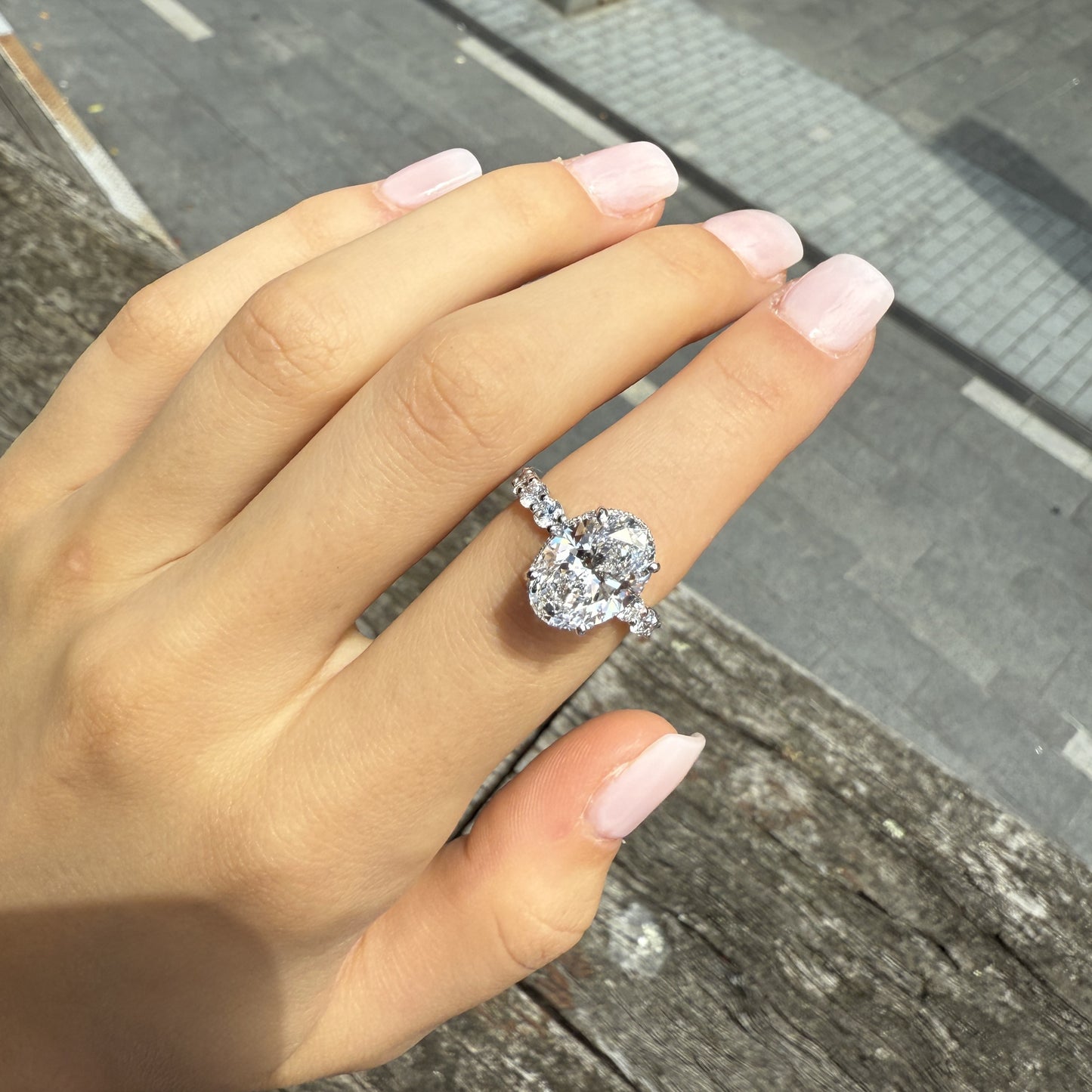 Sophia – Oval Solitaire with 0.1 ct Round Side Stones and hidden halo