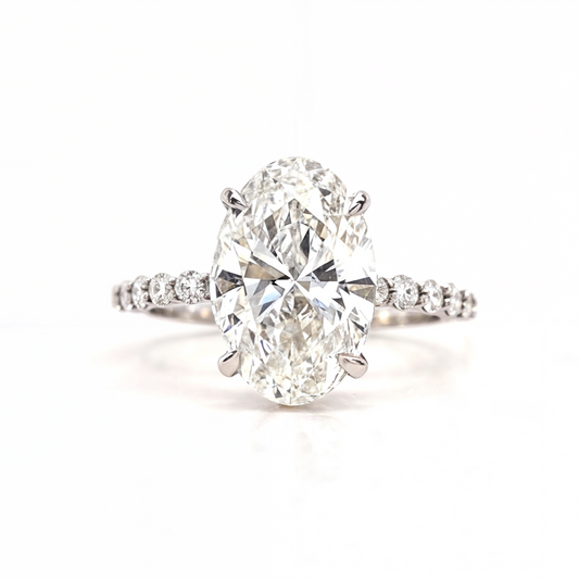 Merry – " 4ct " Oval Solitaire in 18K with round Side Stones and hidden halo (Ready) - Prime & Pure