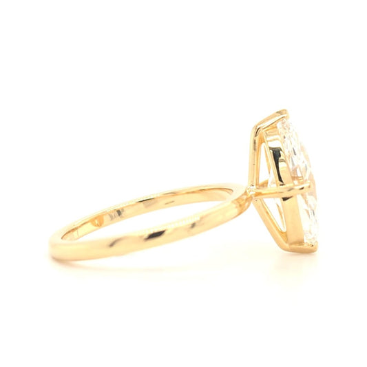 Remi – Marquise solitaire ring with opposite-facing V prongs and round prongs