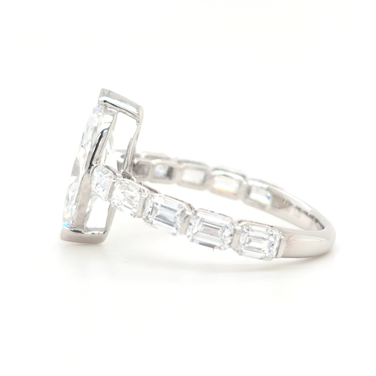 Londyn – Marquise Solitaire with emerald accent band