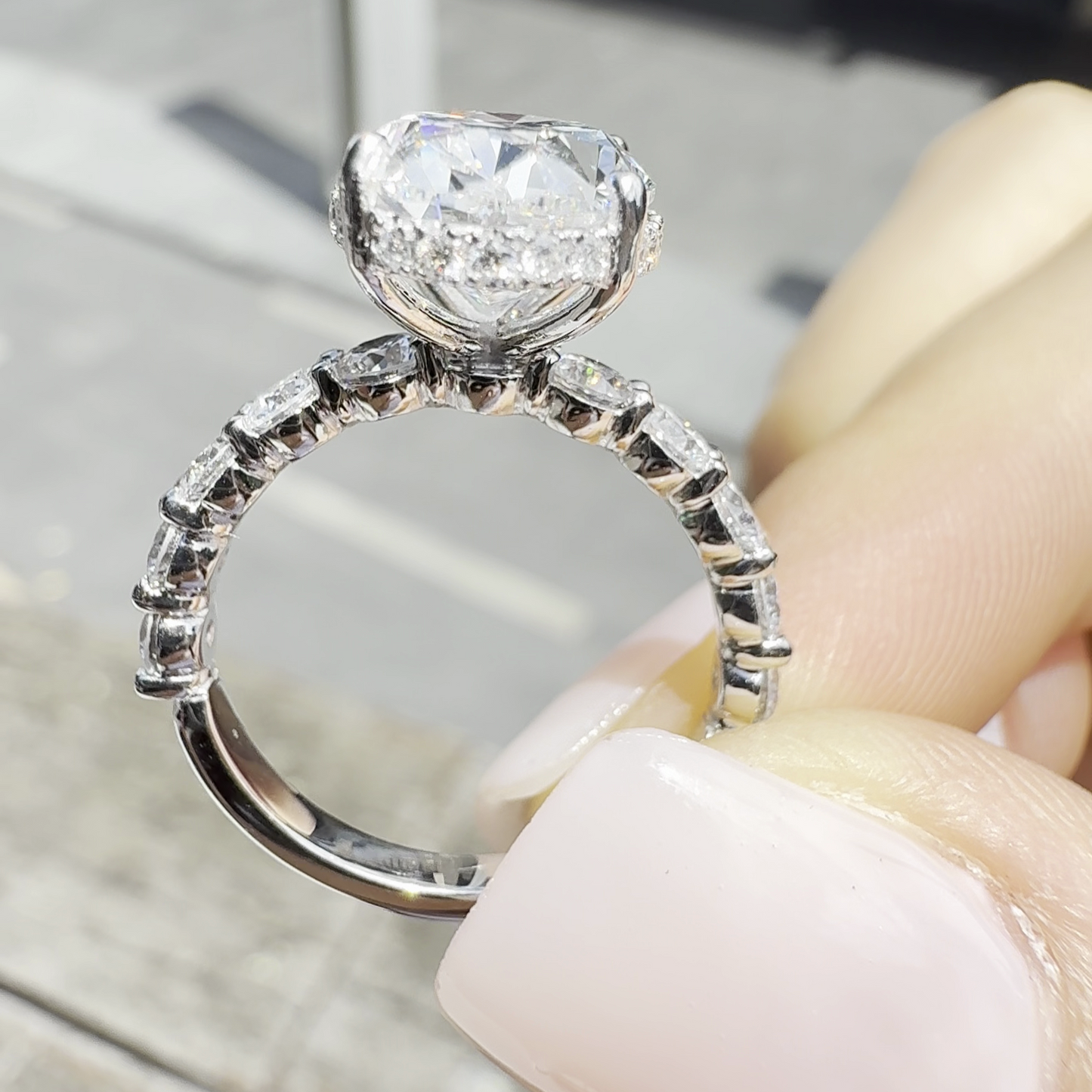 Sophia – Oval Solitaire with 0.1 ct Round Side Stones and hidden halo