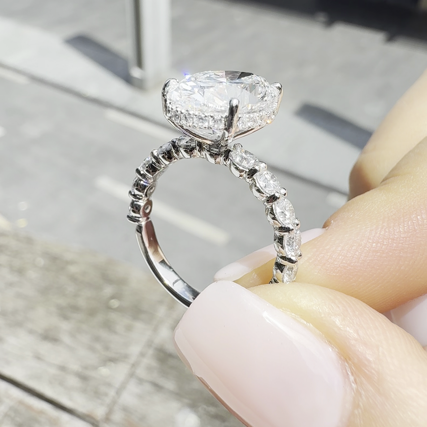 Sophia – Oval Solitaire with 0.1 ct Round Side Stones and hidden halo