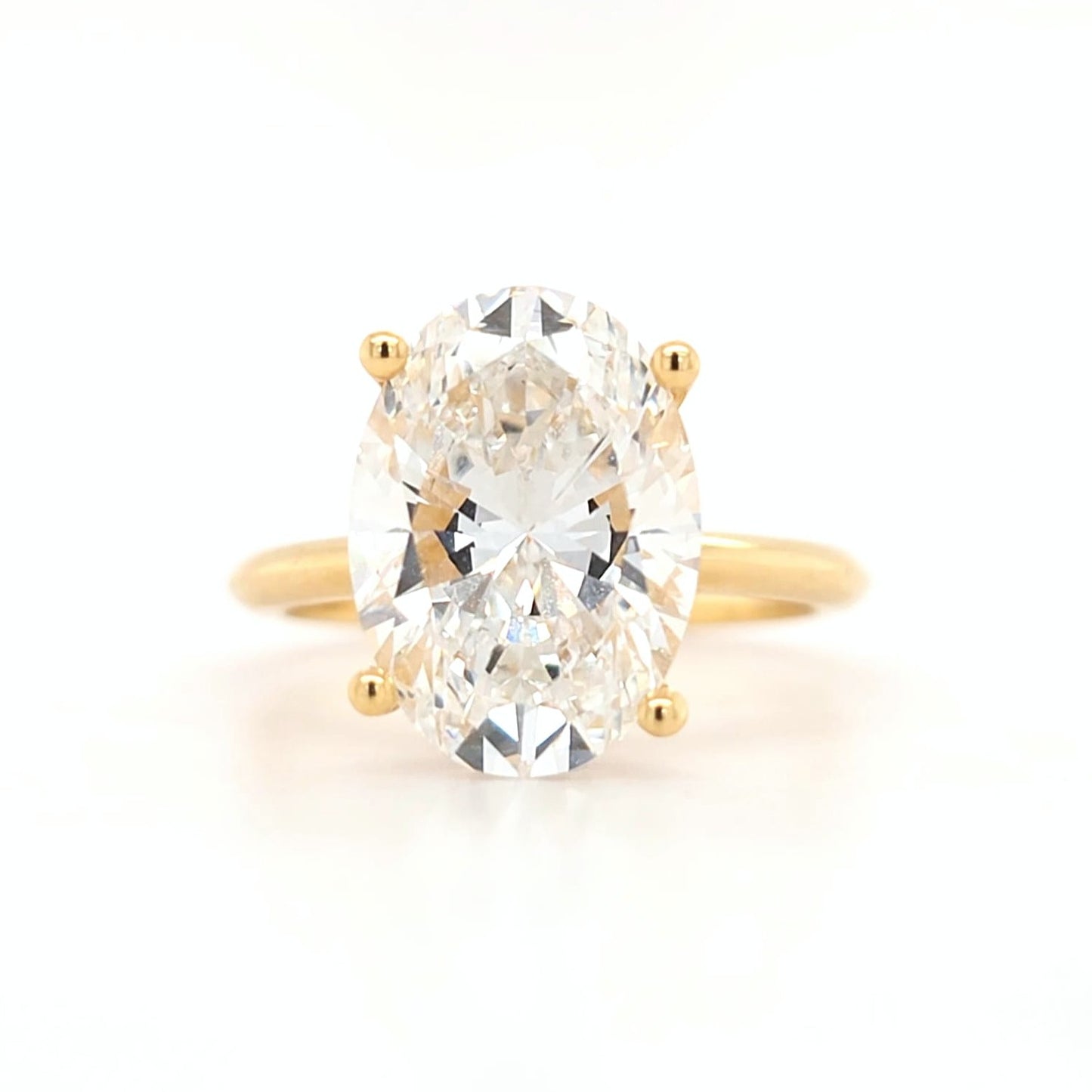 4.2ct - D VS1 Oval Lab Grown Diamond with hidden halo and a plain band Size J