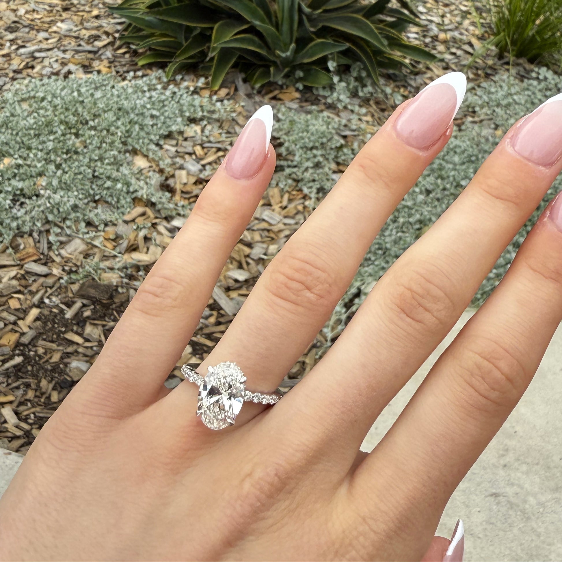 Merry – " 4ct " Oval Solitaire in 18K with round Side Stones and hidden halo (Ready) - Prime & Pure