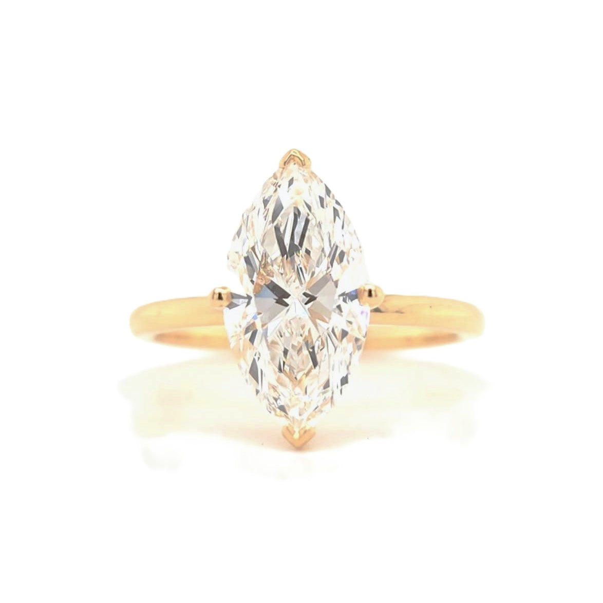 Remi – Marquise solitaire ring with opposite-facing V prongs and round prongs
