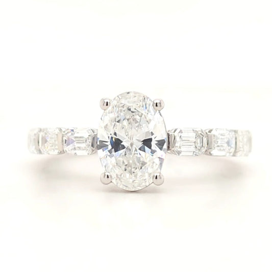 Jordyn – Oval Solitaire with emerald accent band