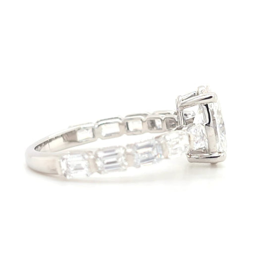 Jordyn – Oval Solitaire with emerald accent band