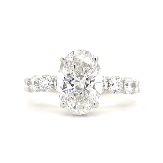 Maggie – Oval Solitaire with Hidden Halo and Round Accents band