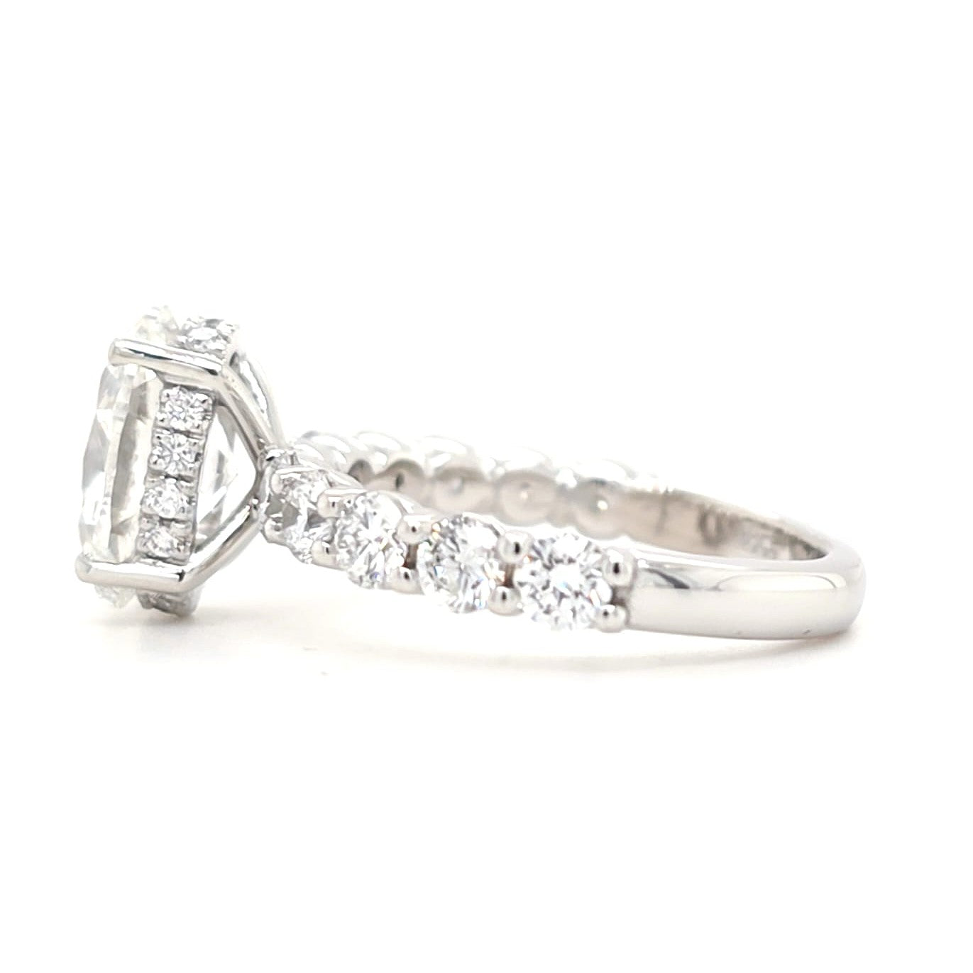 Maggie – Oval Solitaire with Hidden Halo and Round Accents band