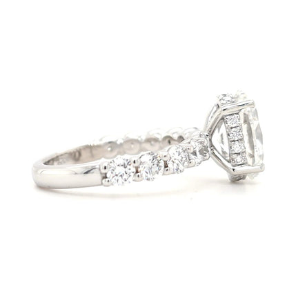 Maggie – Oval Solitaire with Hidden Halo and Round Accents band