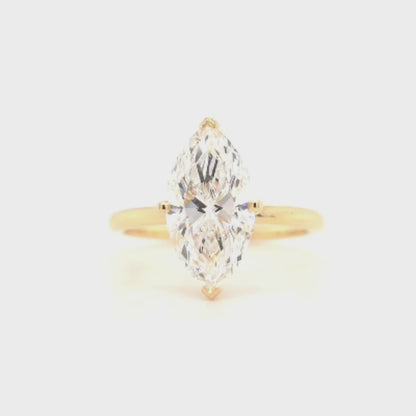 Remi – Marquise solitaire ring with opposite-facing V prongs and round prongs